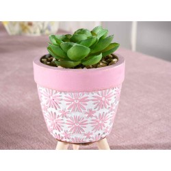 Jarrón de hormigón decorado con planta artificial y trípode